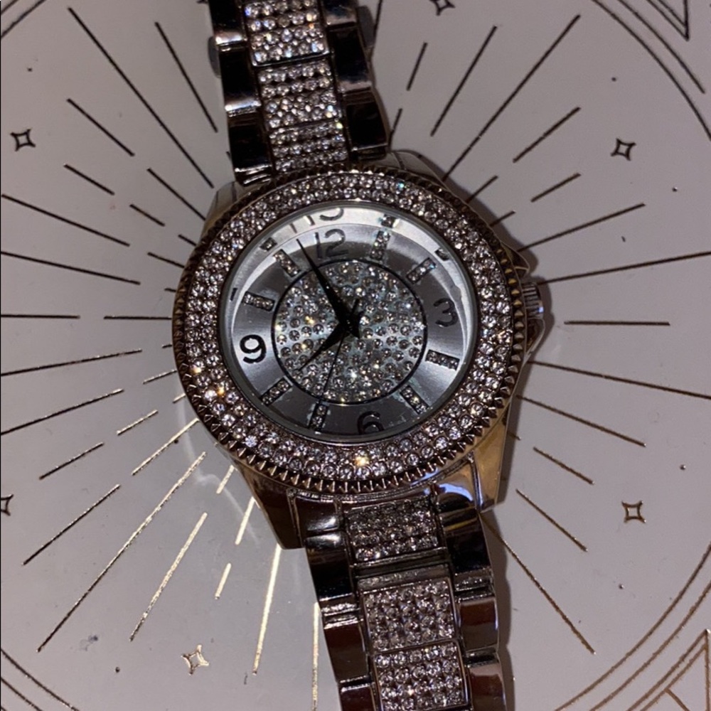 a watch, a necklace and 3 rings